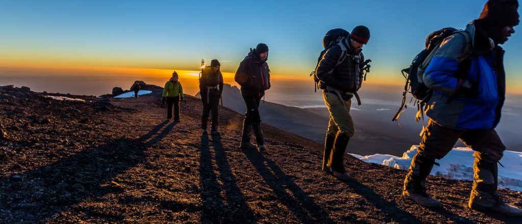 climbers on Kilimanjaro during sunrise